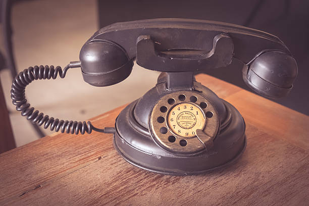 istock old classic telephone on wood table 538182084