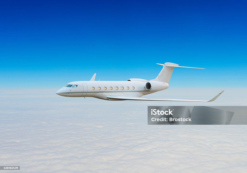 Private jet above the clouds Private jet above the clouds. Corporate Jet Stock Photo