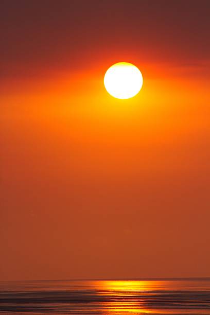 Setting sun over the calm waters of 80 mile beach in the Pilbara region of Western Australia