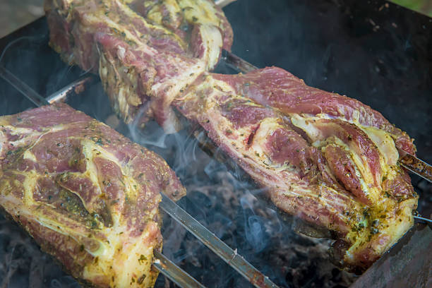 istock barbecueing steak on grill with flames 538183104