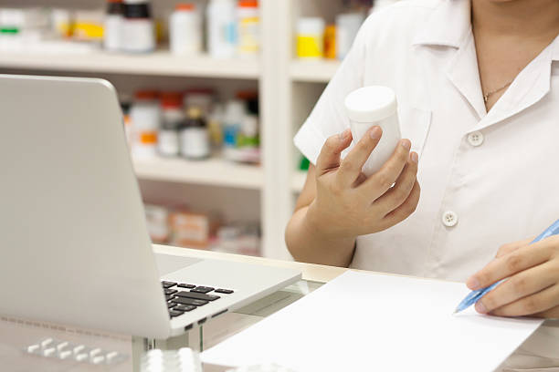 istock Pharmacist with laptop computer and medication in the pharmacy 538183798