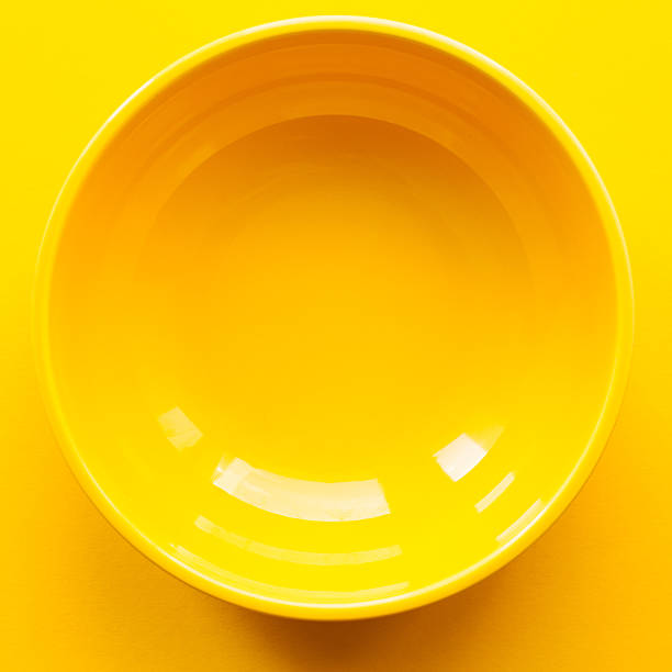 istock New clean yellow bowl or plate. Top view 538184120