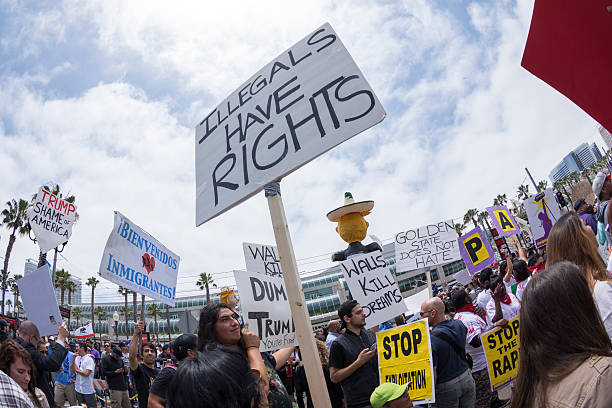 Illegals have rights sign at protest stock photo