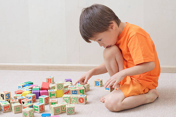 istock Child playing with toy cubes in the room 538187568
