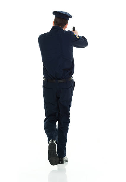 istock Rear view of police aiming with handgun 538190086