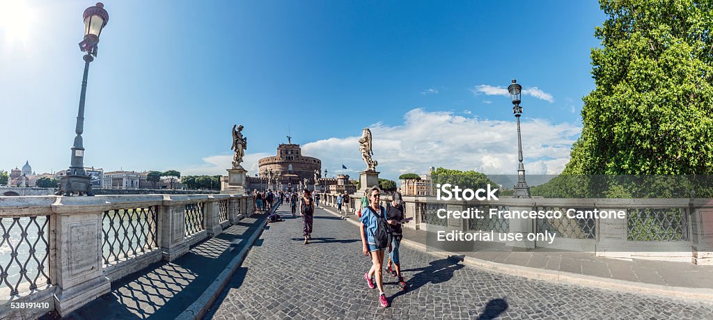 Wide angle panorama with tourists visiting Castel Sant'Angelo Rome, Italy - June 6, 2016: Wide angle panorama with tourists visiting Castel Sant'Angelo (Mausoleum of Hadrian), St. Angelo Bridge and River Tiber Ancient Stock Photo