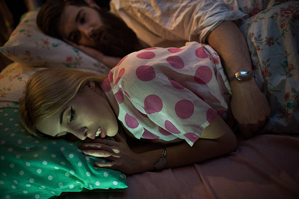 istock Young loving couple lying embraced in their bed. 538191956
