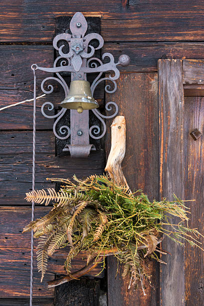Austria, Vorarlberg, Montafon, Silbertal Austria, Vorarlberg, Montafon, Silbertal, doorbell at a door in the Montafon silbertal stock pictures, royalty-free photos & images