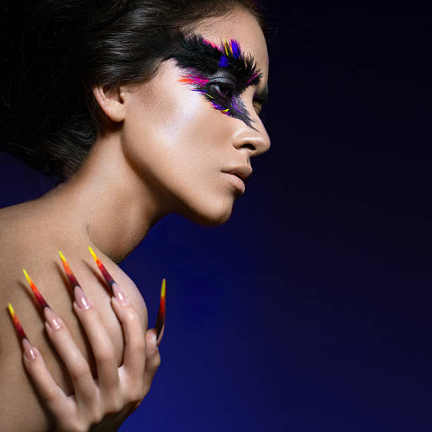 istock Beautiful girl in image of Phoenix bird with creative makeup 538192742