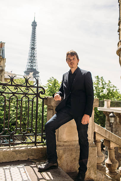 istock Man in black the Eiffel tower on the background 538193146