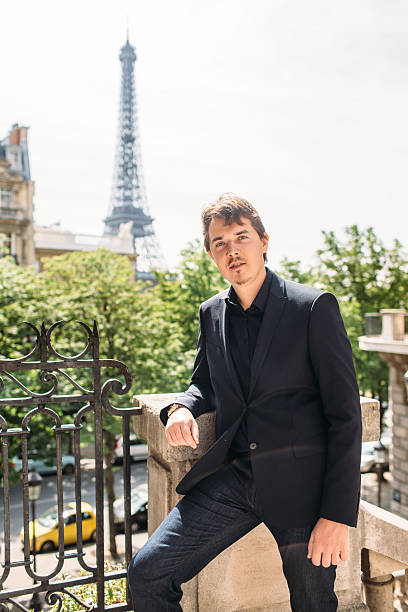 istock Man in black the Eiffel tower on the background 538193176
