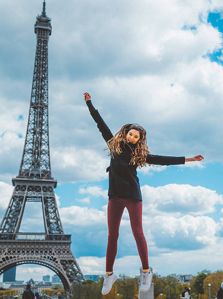 istock Young girl jumping against Tour Eiffel 538197012