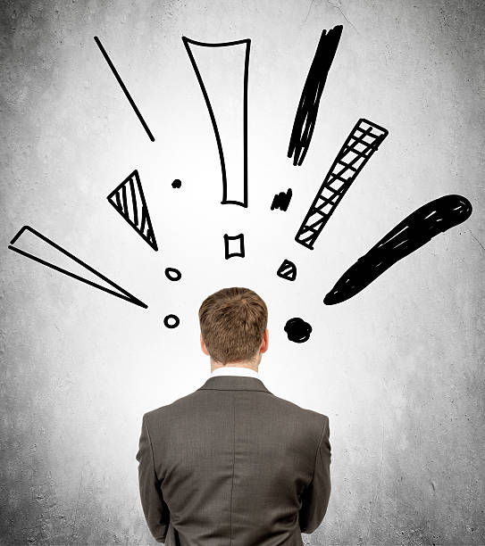 istock Rear view of businessman with exclamation marks 538197154