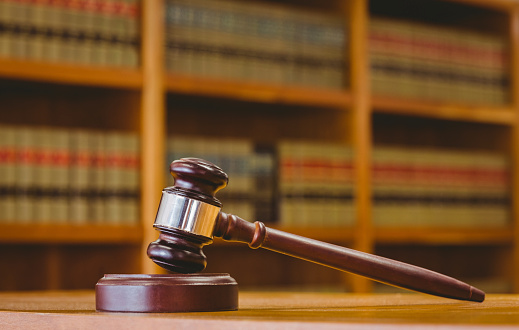 Gavel resting on sound block in library