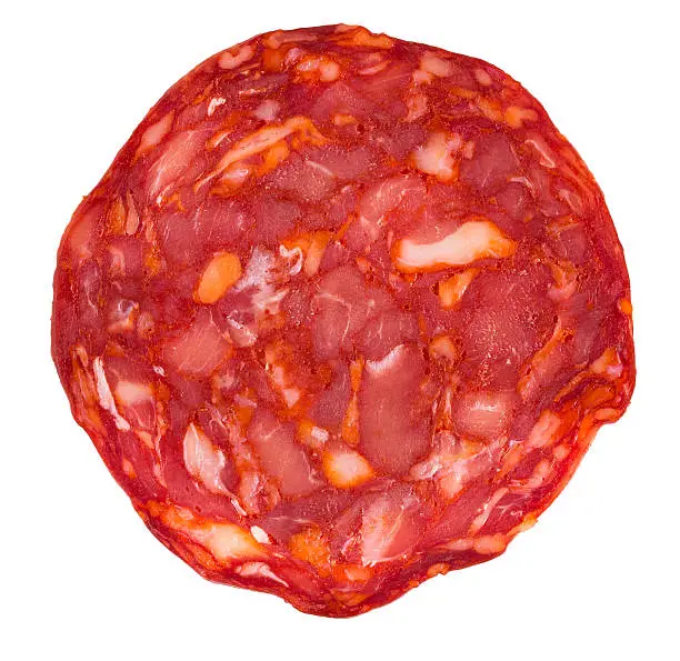 Background of Structure minced meat and cut sausage chorizo. Macro background.Cut Spanish sausage or salami chorizo. Isolated on white. Macro