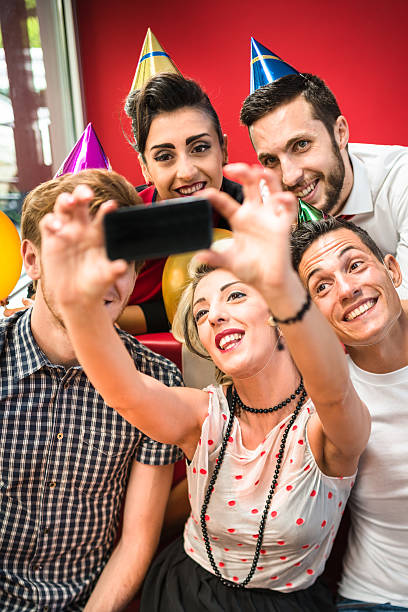 istock taking a selfie during a birthday party 538206441