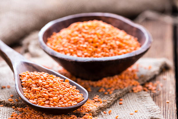 istock Red Lentils on a wooden spoon 538206743