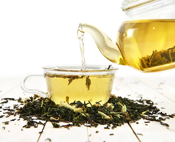 istock Glass cup and kettle with raw tea leaves 538206759