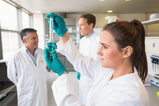 istock Young scientist holding up test tube 538206853