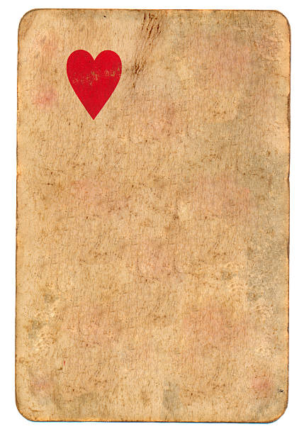 istock lonely red heart symbol on old playing card paper background 538206867