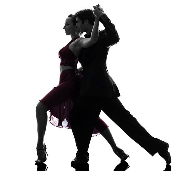 couple man woman ballroom dancers tangoing  silhouette one  couple man woman ballroom dancers tangoing in silhouette studio isolated on white background rumba photos stock pictures, royalty-free photos & images