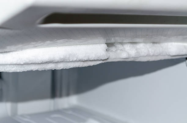 Defrost Freezer Open a freezer, defrosting and cleaning. meat locker photos stock pictures, royalty-free photos & images
