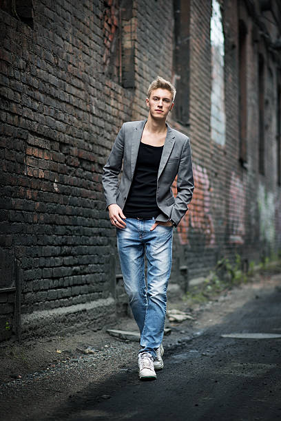 istock Young attractive man on abandoned background. Outdoor 538235269