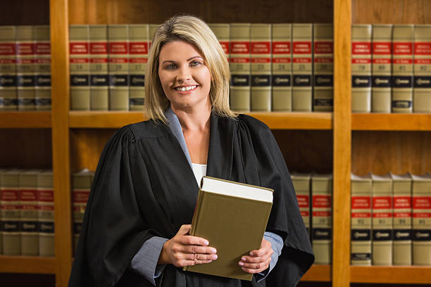 istock Lawyer holding book in the law library 538235439