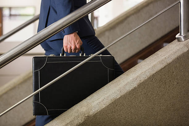 istock Businessman climbing up the stairs 538235769