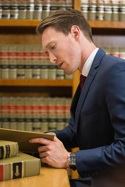 istock Handsome lawyer in the law library 538235835