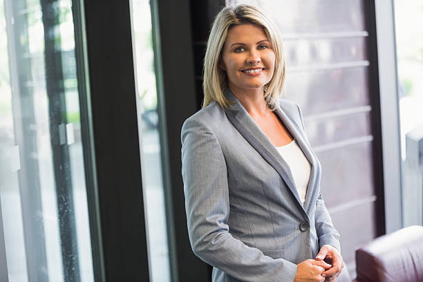 istock Blonde businesswoman smiling at camera 538236047