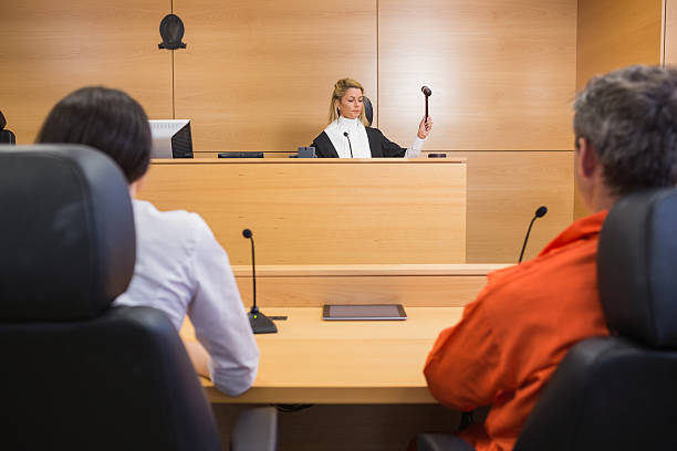 istock Lawyer and client listening to judge 538236361