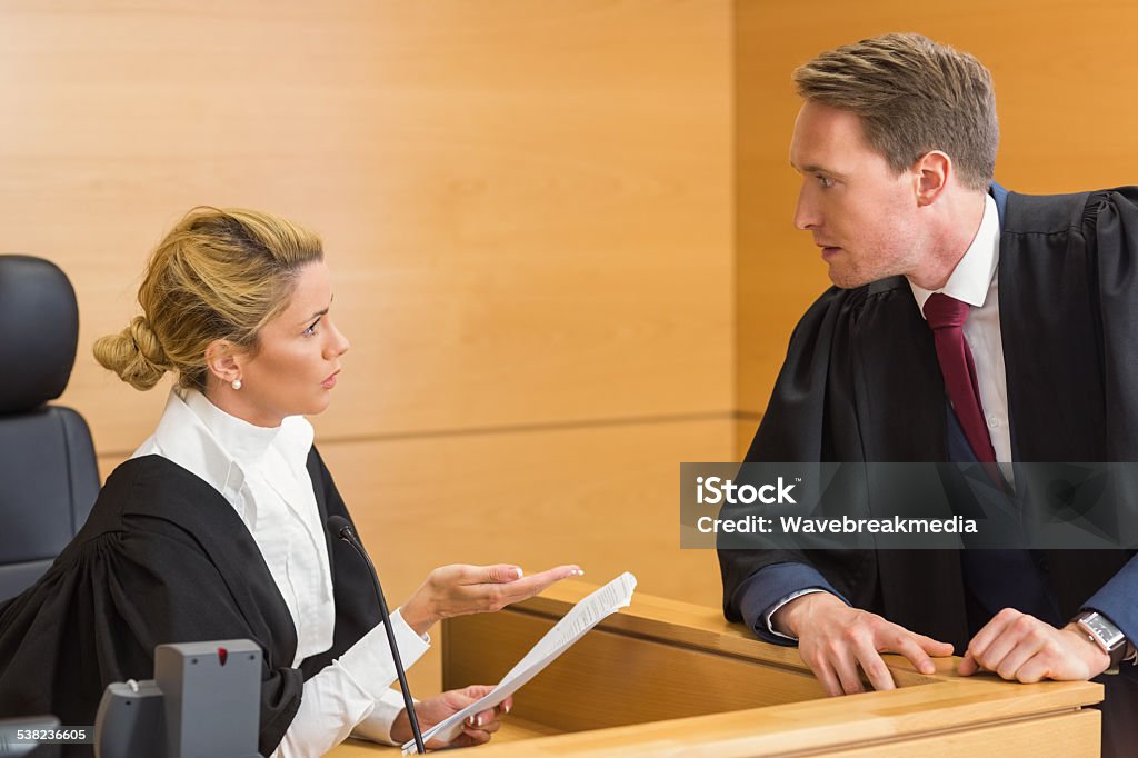 Lawyer speaking with the judge Lawyer speaking with the judge in the court room 20-29 Years Stock Photo