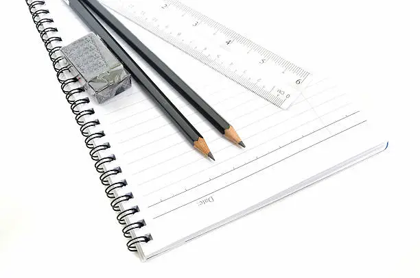 Blank page with pencils, eraserand ruler isolated on white background