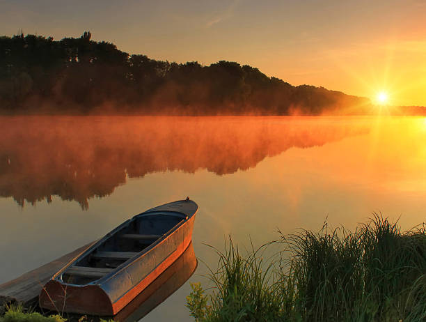 istock Boat on the shore of a misty lake 538238461
