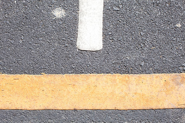 istock yellow and white line on the road texture background 538238737