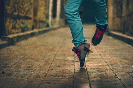 Feet  of hip-hop performer in sneakers