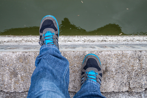 A men jumnig of a bridge. First person view.