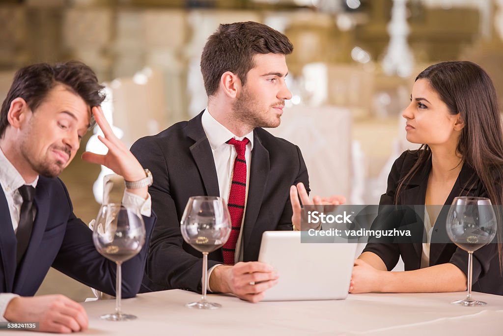 Business lunch Business lunch. Business partners are meeting in restaurant to discuss plan of work.Business lunch. Business partners are meeting in restaurant to discuss plan of work. 2015 Stock Photo