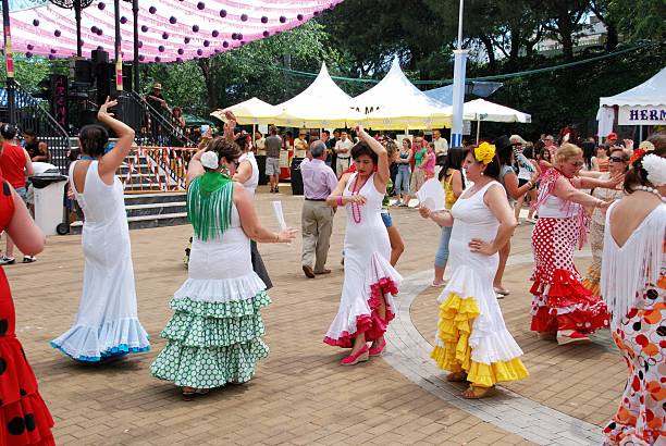 Marbella, Spain - June 12, 2008: Spanish women flamenco dancing during the Romeria San Bernabe festival, Marbella, Costa del Sol, Malaga Province, Andalusia, Spain, Western Europe.