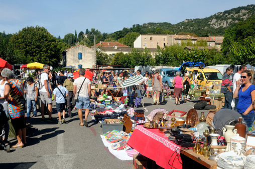 Anduze, France – August 24, 2014: Flea Anduze every Sunday morning throughout the year where tourists and locals meet to buy or sell. Here glass colors.