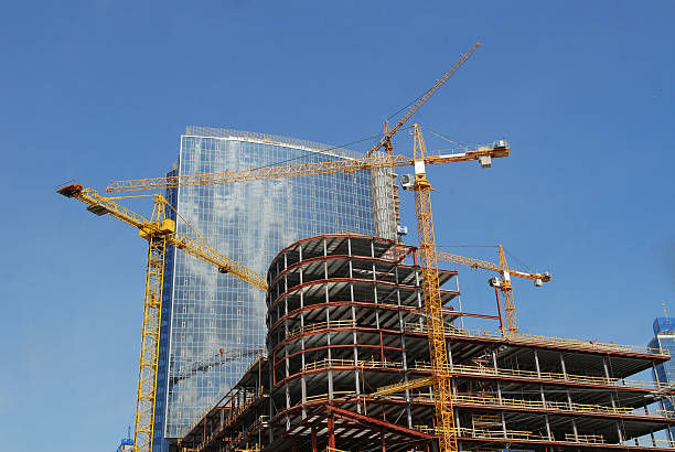 istock blue glass high rise tower with a crane 538258347