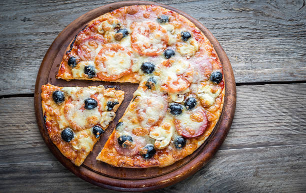 istock Cooked pizza on the wooden board 538258431