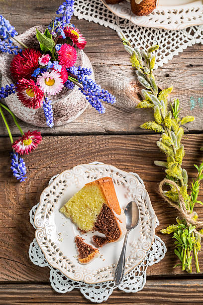 istock Easter cake, cup of coffee and spring flowers 538262011