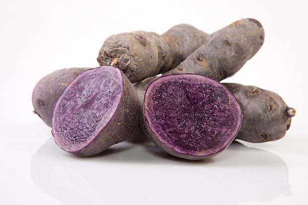 istock Sliced and whole Vitelotte potatoes 538263123