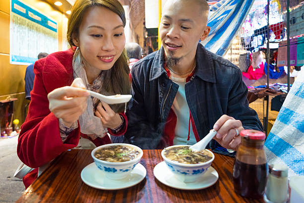 istock Couple Eating Snake Soup 538263575