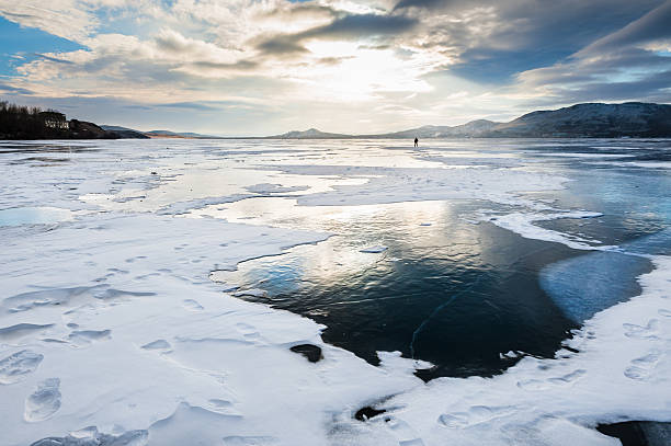 istock Beautiful ice on the lake at sunset 538263765