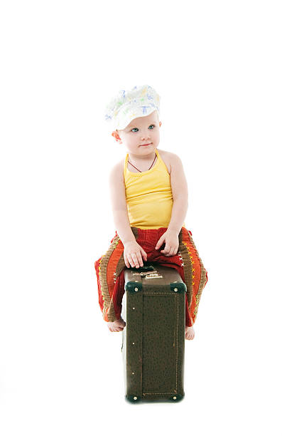 istock the girl sits on  suitcase 538263919