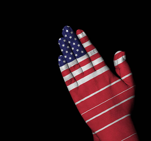 istock Prayer - USA flag painted on hands 538264409