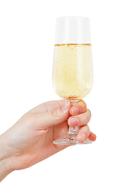 mão segura com taça de champanhe - champagne flute wine isolated wineglass - fotografias e filmes do acervo